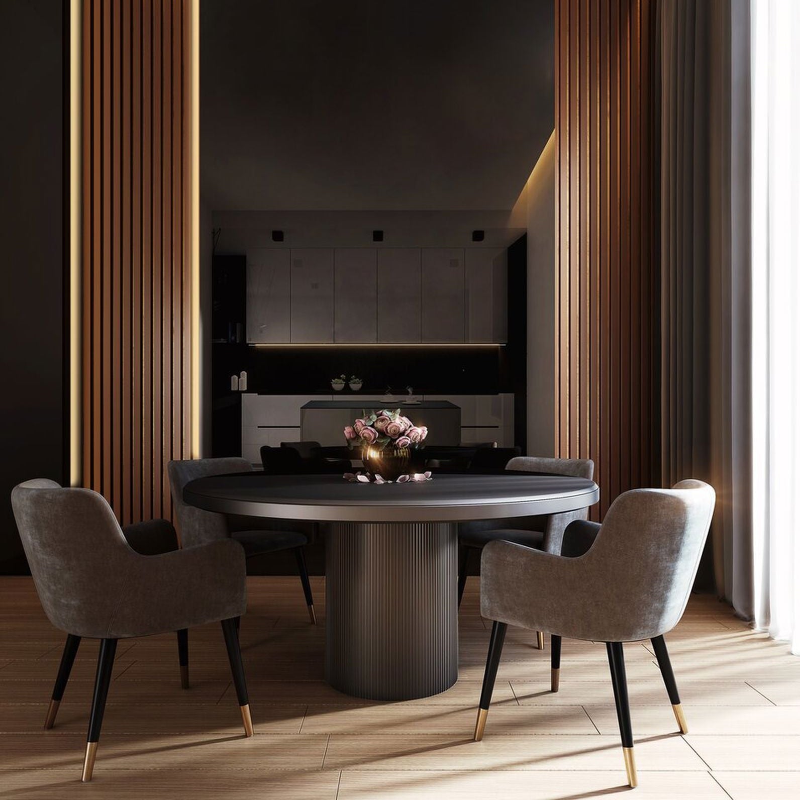 Modern dining room with a round table and chairs in a stylish interior setting.